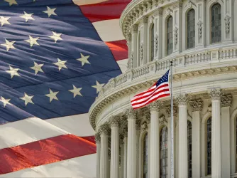 Capitol Building dome with an American flag in the background in Washington DC