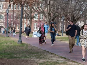College students walk across the campus of UNC-Chapel Hill.