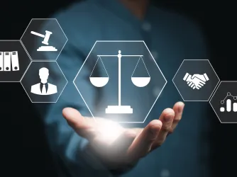 Computer screen showing a gavel scales of justice and books indicating the legal process and procedural fairness