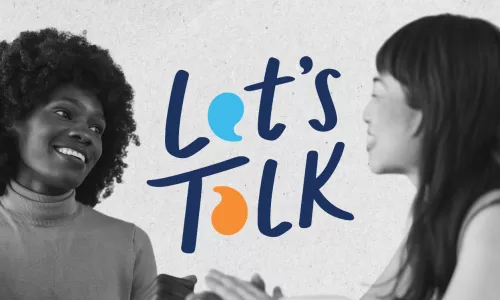 Two women smiling and talking with the phrase "Let's Talk" between them.