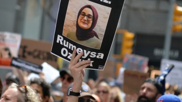 People marching at a demonstration against the Trump Administration's deportation of pro-Palestinian student activists on April 19, 2025.