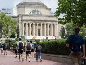 Students at the Columbia University campus with the Low Memorial Library in the background