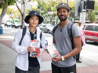 Students handing out Let's Talk flyers